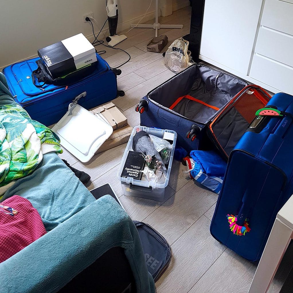 Moving abroad and packing our luggage on the floor of our apartment