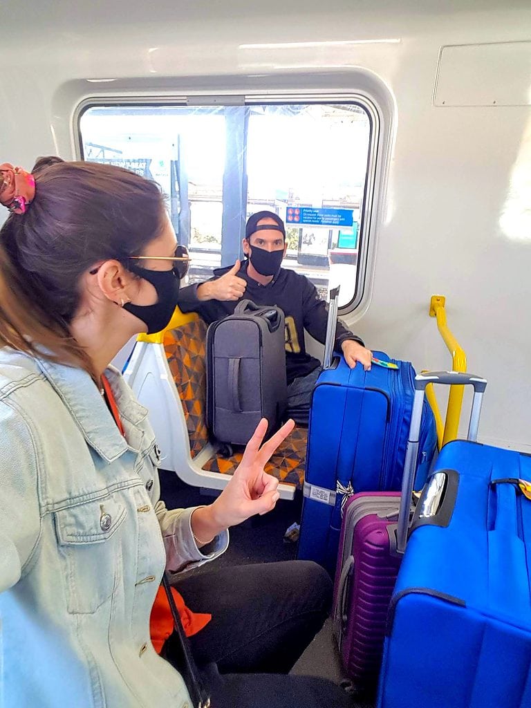 On a train in Melbourne with our luggage as we prepare to move abroad