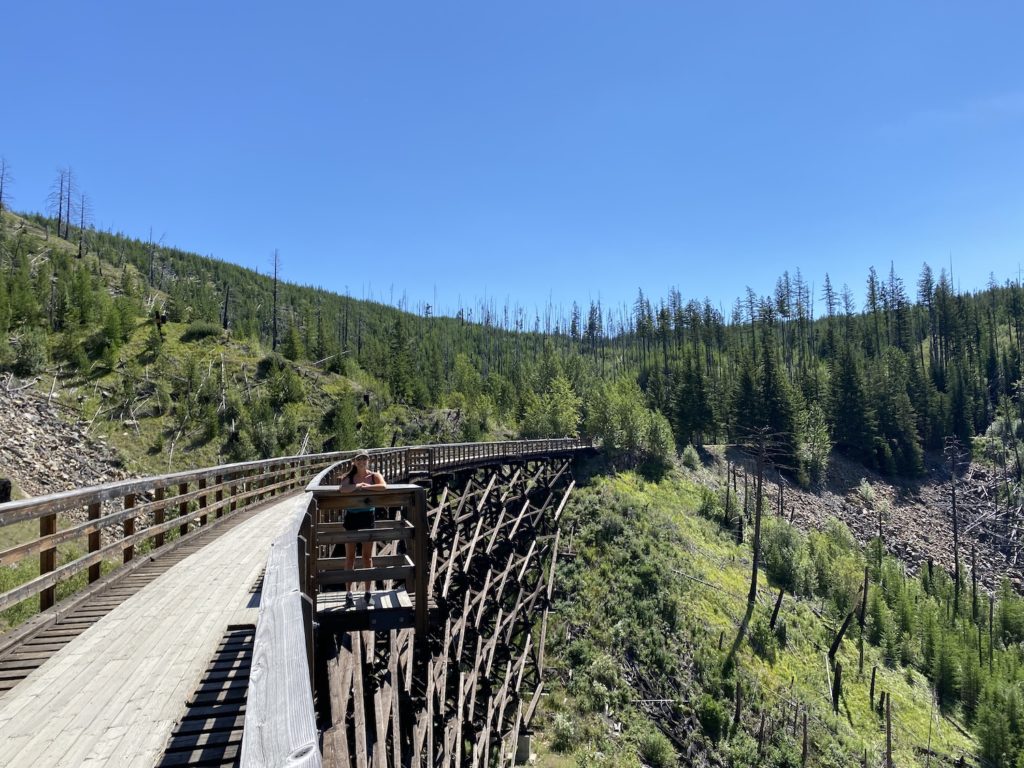 Aly on the Trestles with the Myra Canyon Valley in the Background