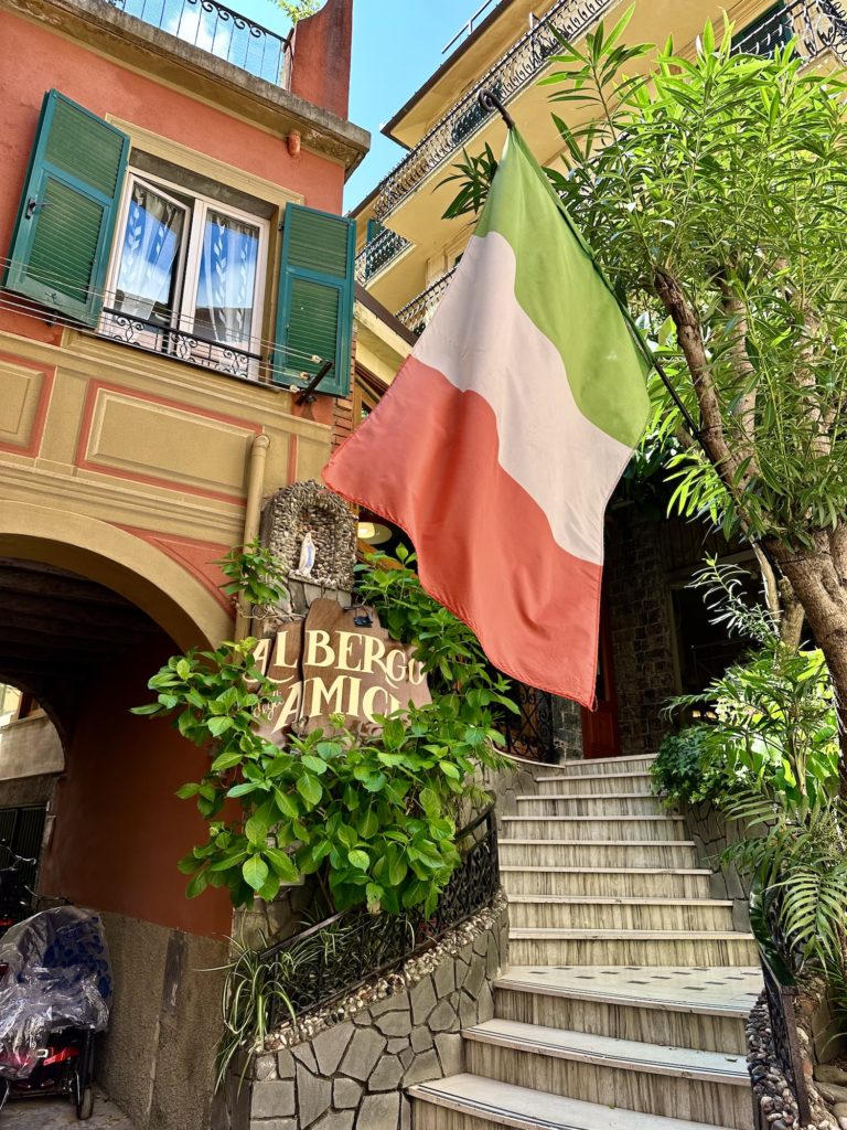 winding stairs under an Italian flag
